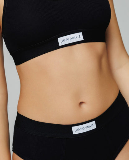 Top in costina con elastico e etichetta Nero