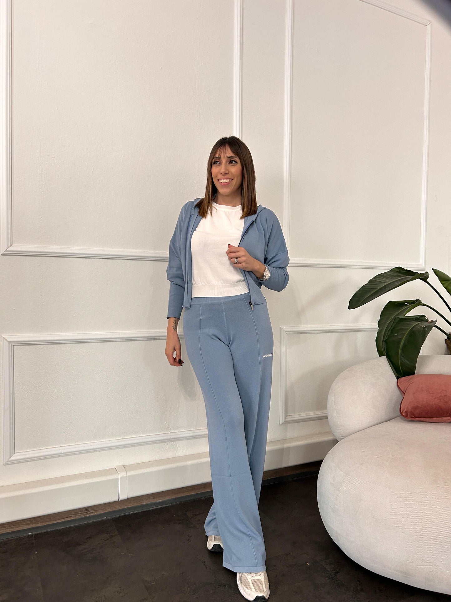 Pantalone a palazzo in maglia azzurro polvere