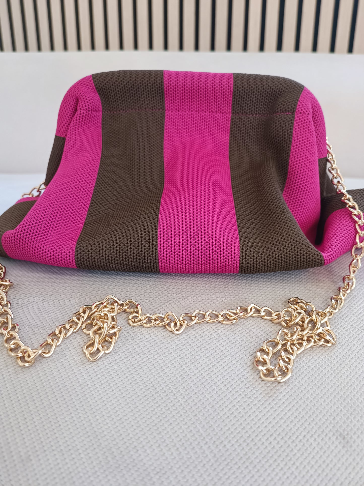 Pochette clutch rigata fucsia e moro